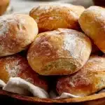 Freshly baked homemade bread loaves on a wooden table