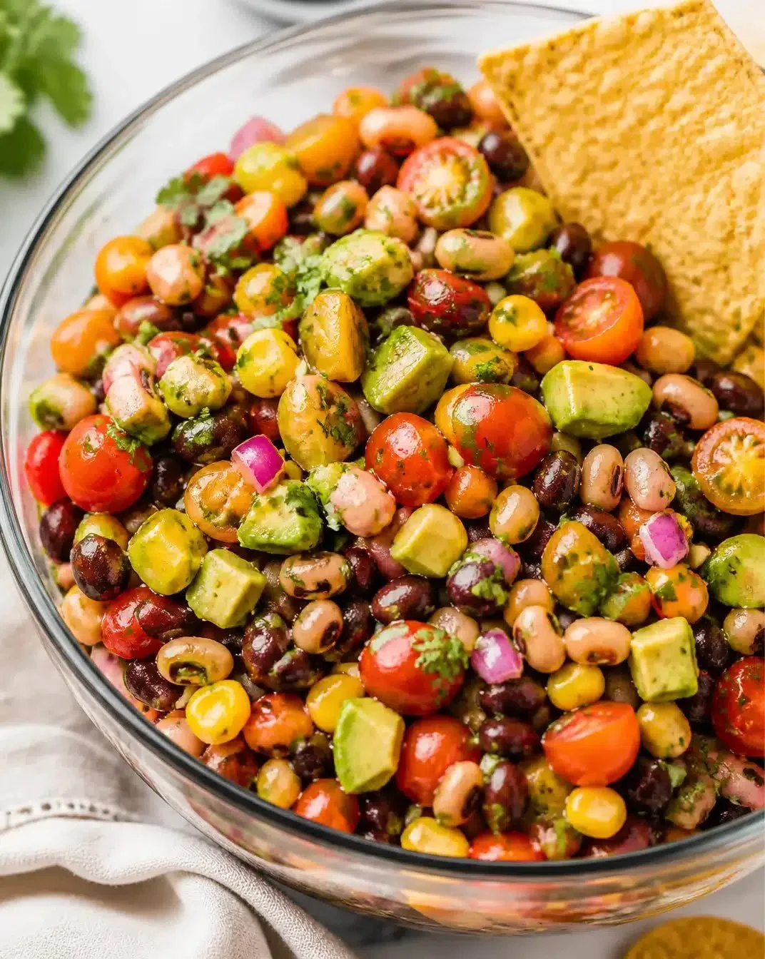 Bowl of colorful Cowboy Caviar with beans, corn, and vegetables
