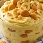 Deliciously creamy banana pudding with a thick, juicy texture served in a bowl.