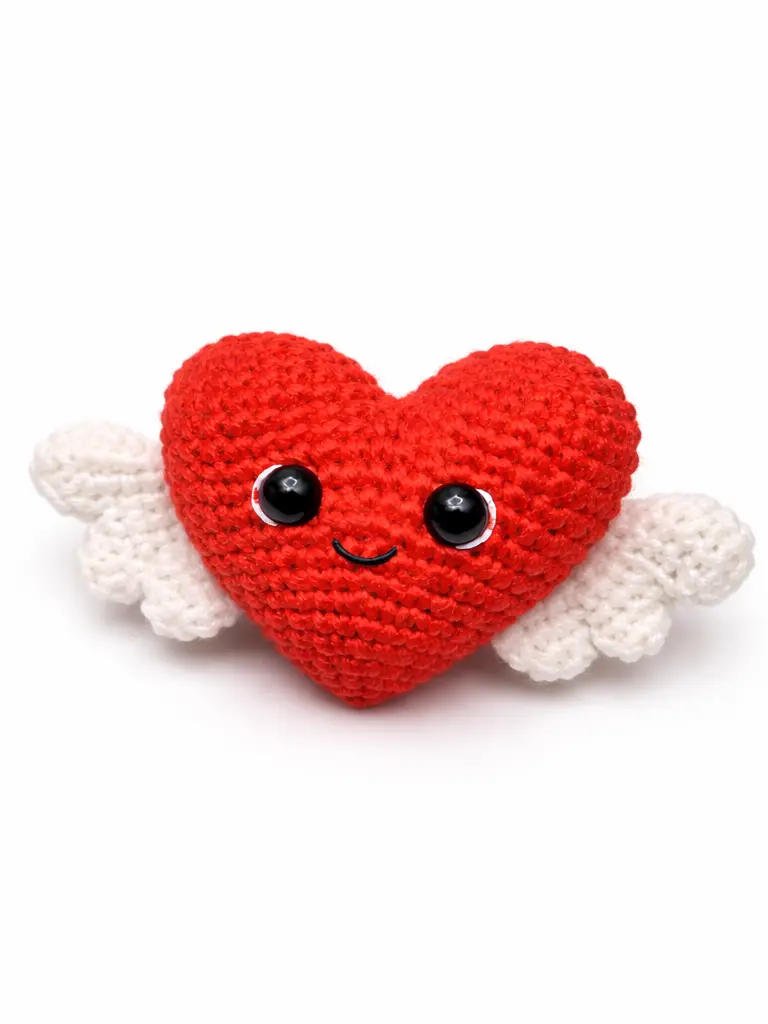Crochet heart pattern free angel Valentine heart plush with wings on white background