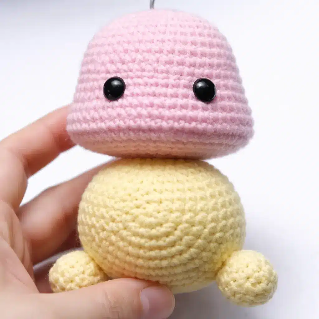 Pastel Caterpillar Crochet Pattern Free Amigurumi Tutorial 3 Head step for pastel caterpillar crochet pattern showing pink crochet head and first yellow body segment