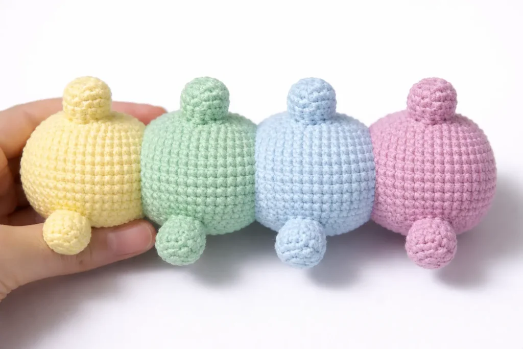 Pastel Caterpillar Crochet Pattern Free Amigurumi Tutorial 4 Legs step for pastel caterpillar crochet pattern showing pastel body segments and small crochet legs